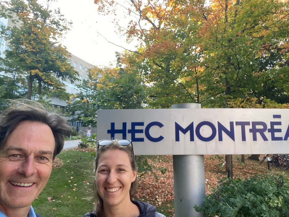 Prof. Dr. Christoph Barmeyer and Elisabeth Huber in front of the logo of HEC Montr&eacute;al