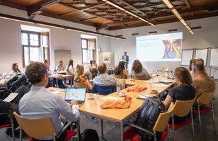 Symposium participants in the room during presentation