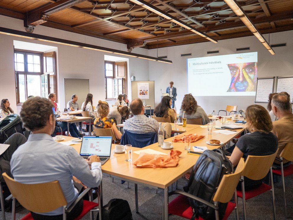 Symposium participants in the room during presentation