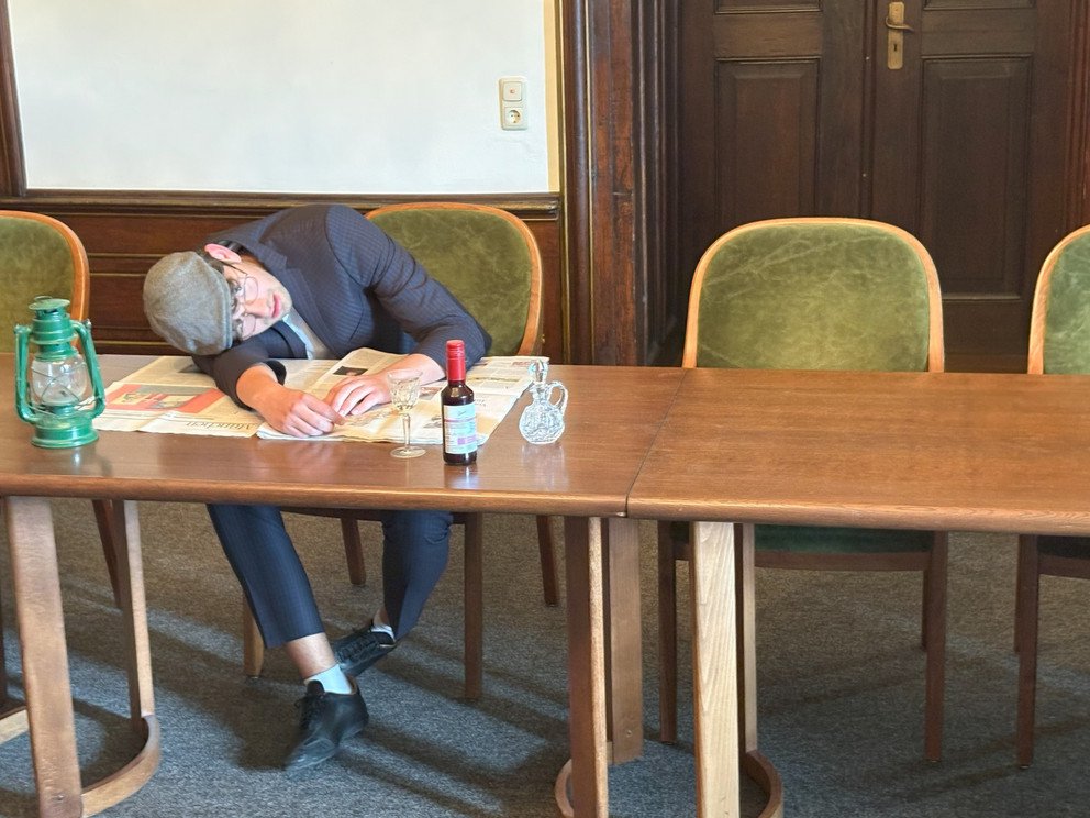 Ayoung man lying on a table