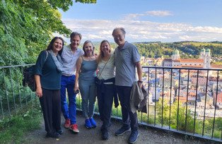 Five participants with a view of Passau from Veste Oberhaus