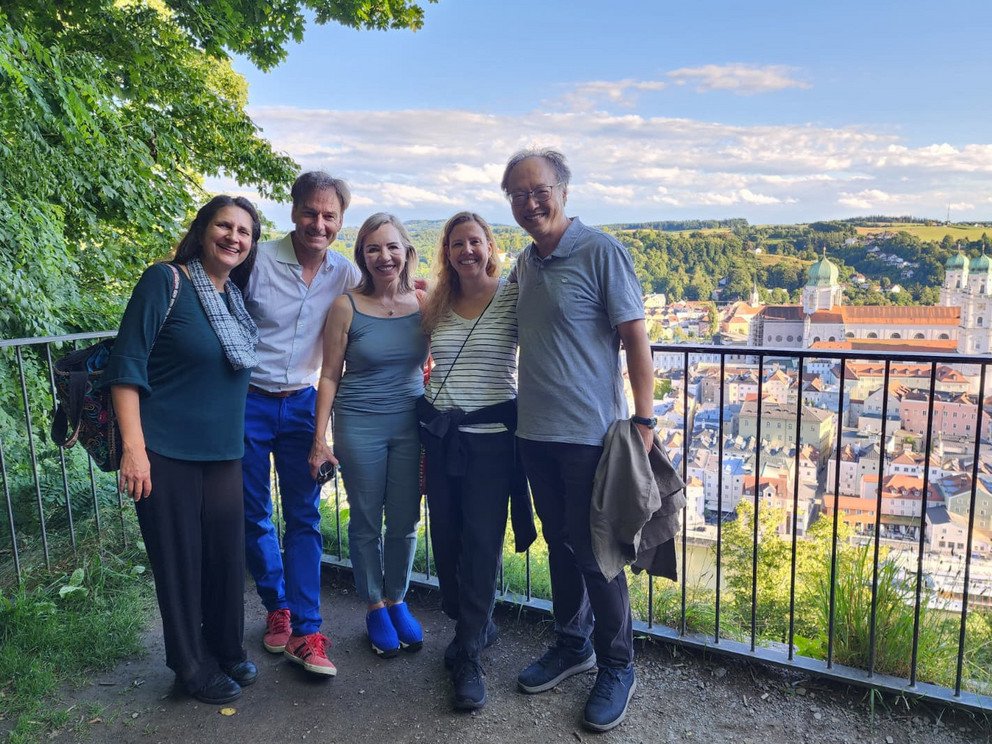 Five participants with a view of Passau from Veste Oberhaus