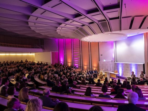 A lecture hall lit up in pink color
