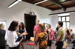Two female participants discussing in a working group