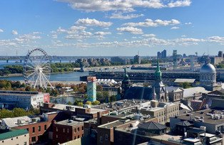 View over port of Montréal with ferris wheel and different buildings